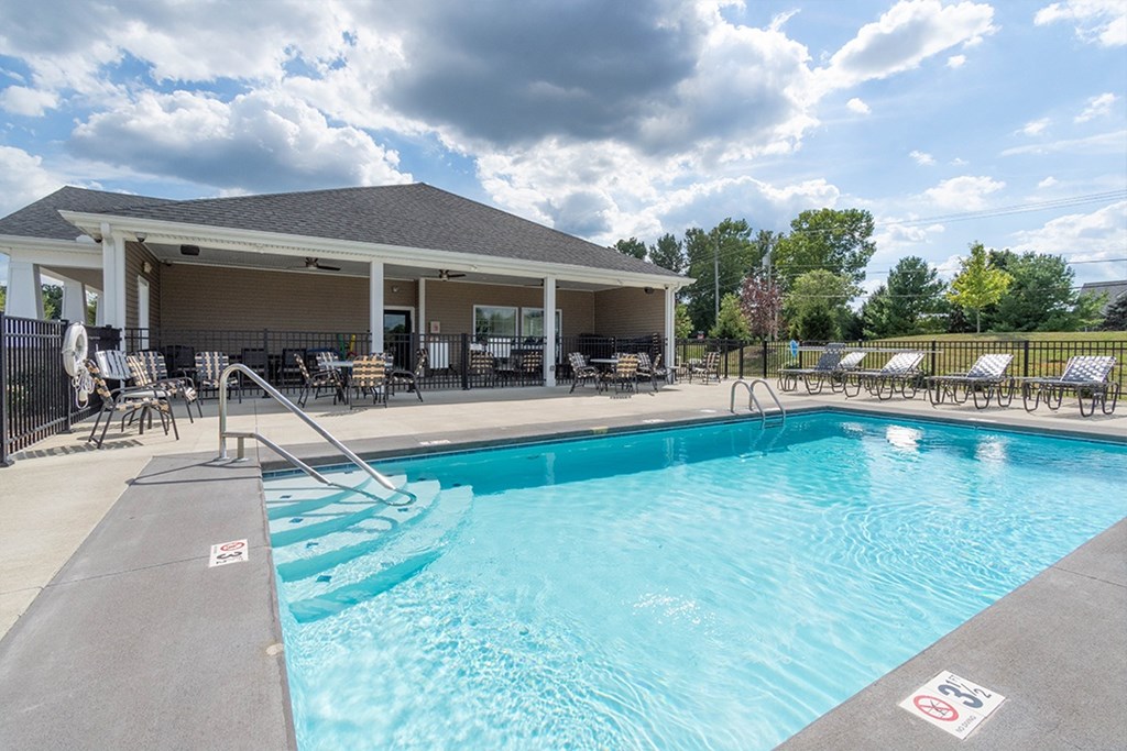 A pool with a no swimming sign on the side.
