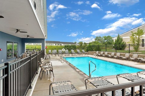 Private community pool with shaded seating for relaxation