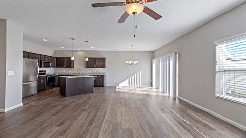 Spacious living room with hardwood-style floors in Florence, KY home