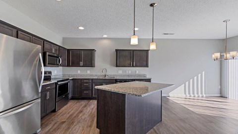 Modern kitchen with pendant lighting and stainless steel appliances in a Florence, KY rental home