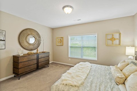 Cozy bedroom with large windows and blinds in Florence, KY ranch-style rental home