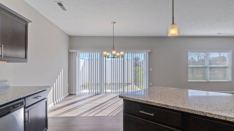 Spacious kitchen island with bar seating in Florence, KY home