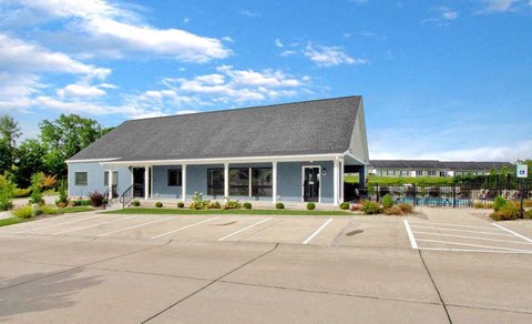 Resident clubhouse and leasing office with guest parking at The Villages of Florence and Weaver Mill