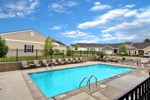 Sparkling outdoor pool with sundeck in Florence, KY rental neighborhood
