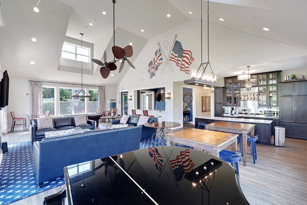 a living room and kitchen flags on the wall