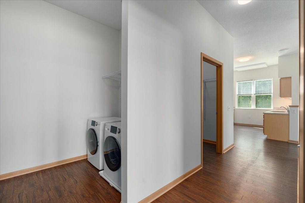 A laundry room with a washer and dryer.