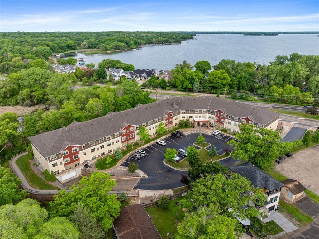 A large building with a parking lot in front of it.
