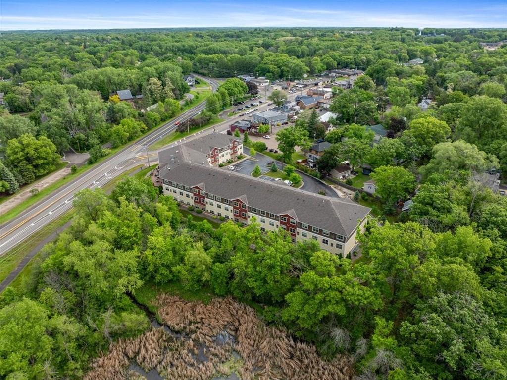 A bird's eye view of a town with a large building in the center.