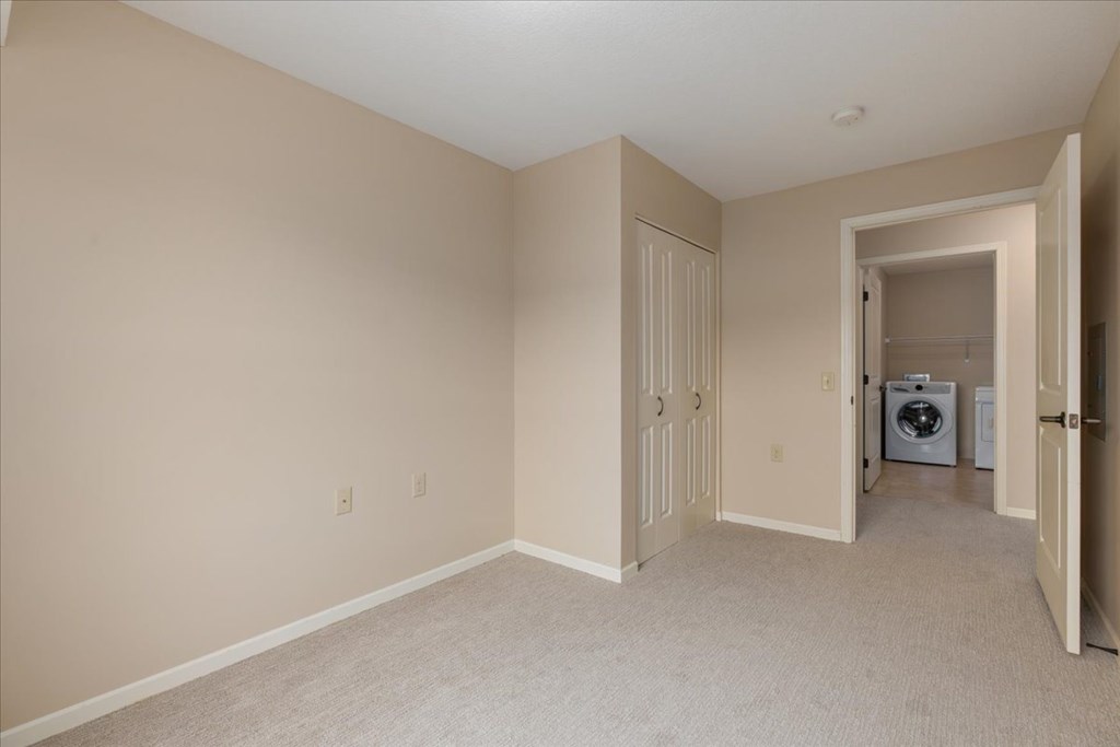A room with a washer and dryer in it.
