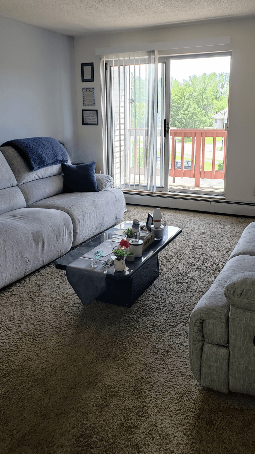 a living room with couches and a coffee table