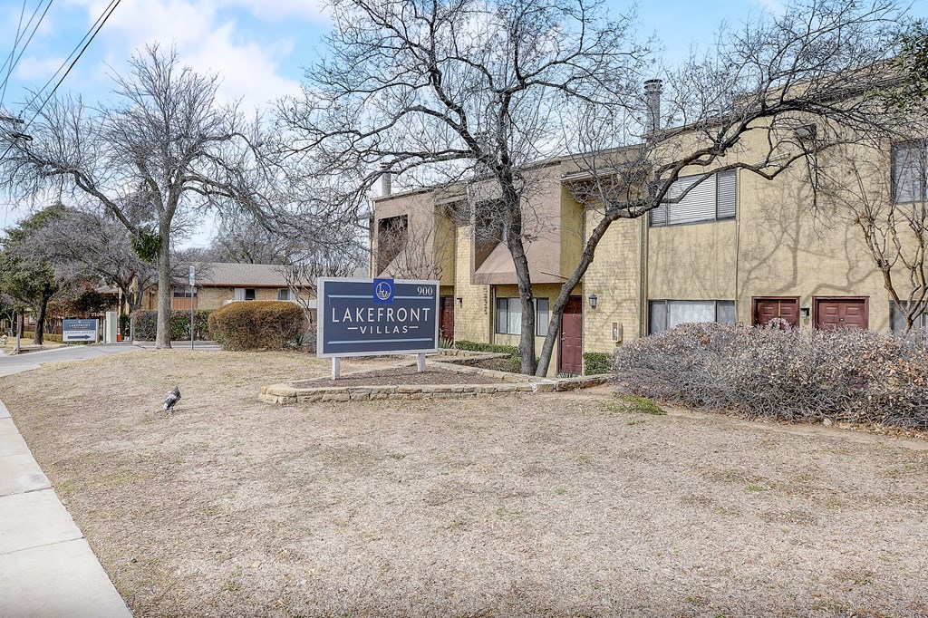 a building with a lagoon village sign in front of it