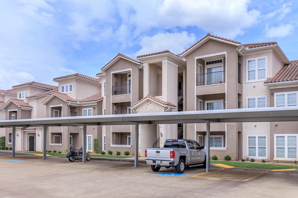 A row of houses with a truck parked in front.