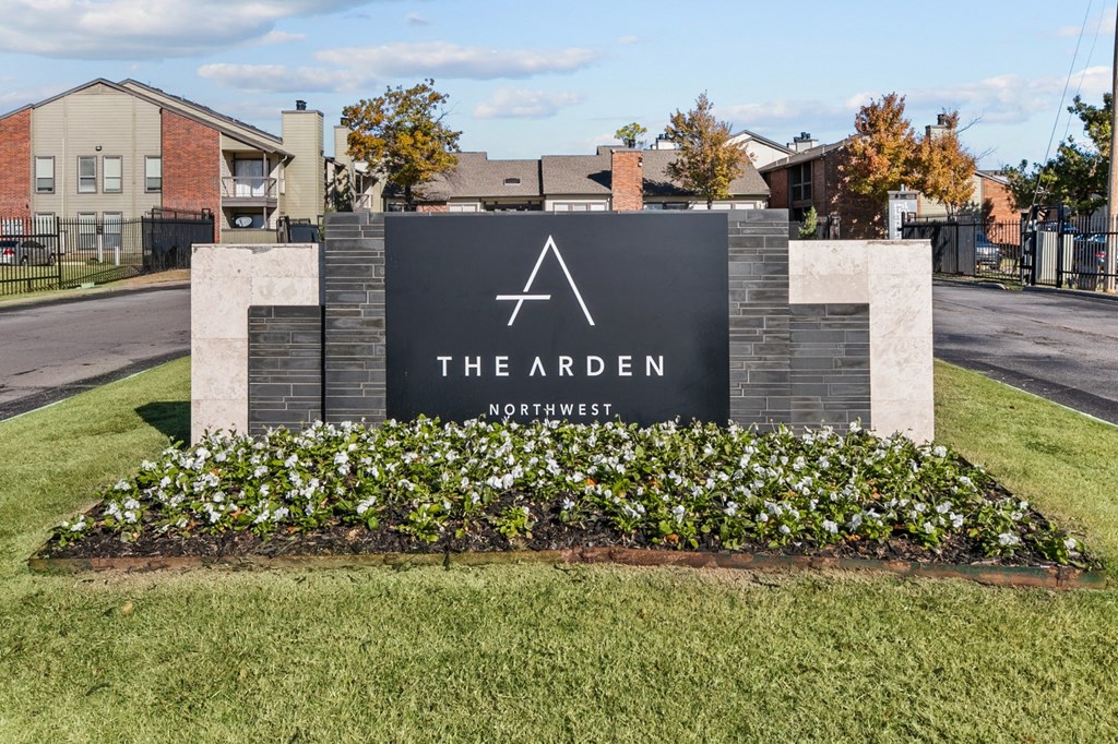 the arden apartment entrance sign in front of an apartment complex