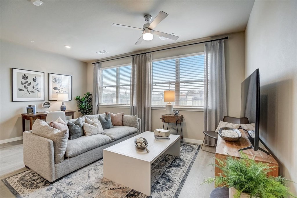 a living room with a couch and a tv