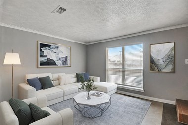 a living room with gray walls and a white couch