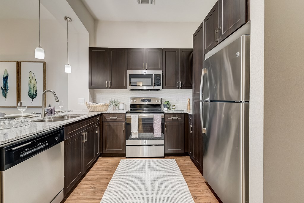 spacious kitchen with stainless steel appliances at the reserve at walnut creek apartments