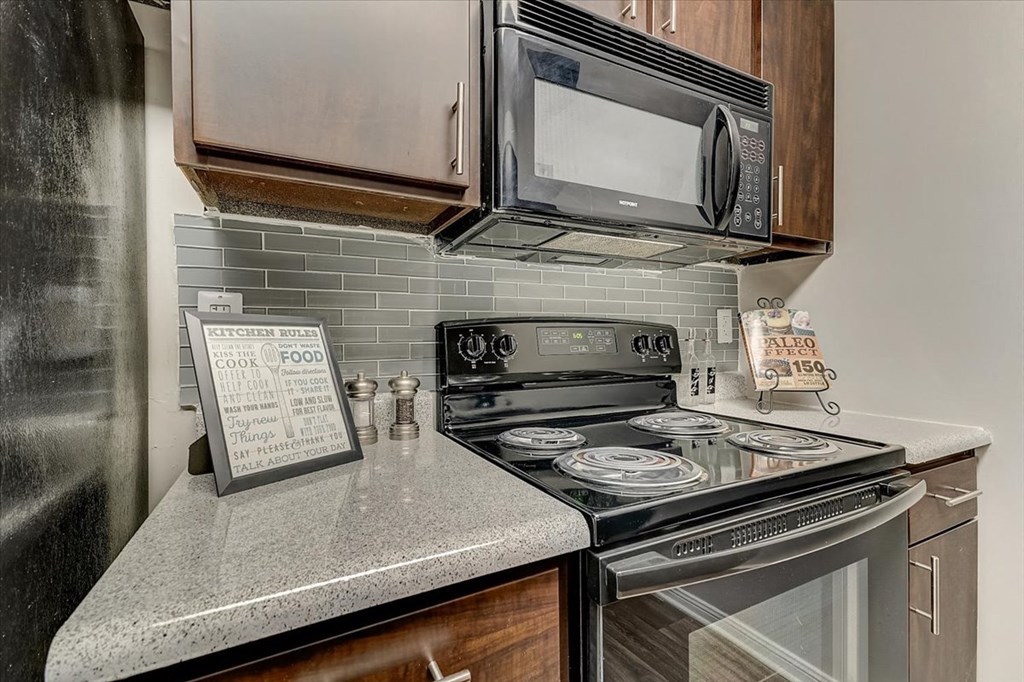 a kitchen with a stove and a microwave