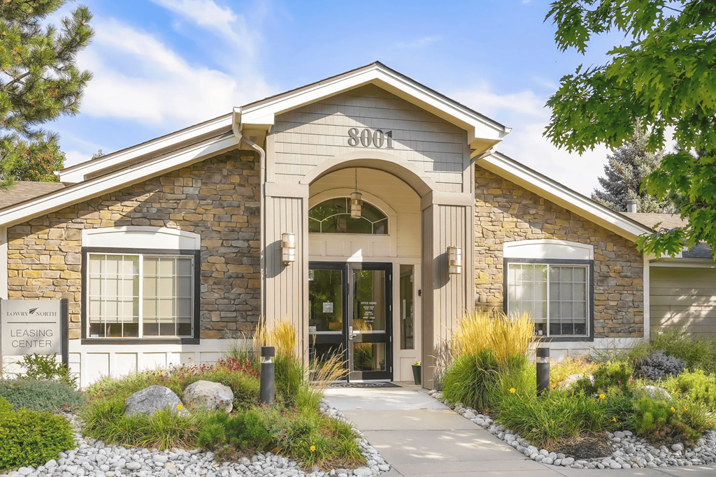 the front of a building with a door and a sign on it
