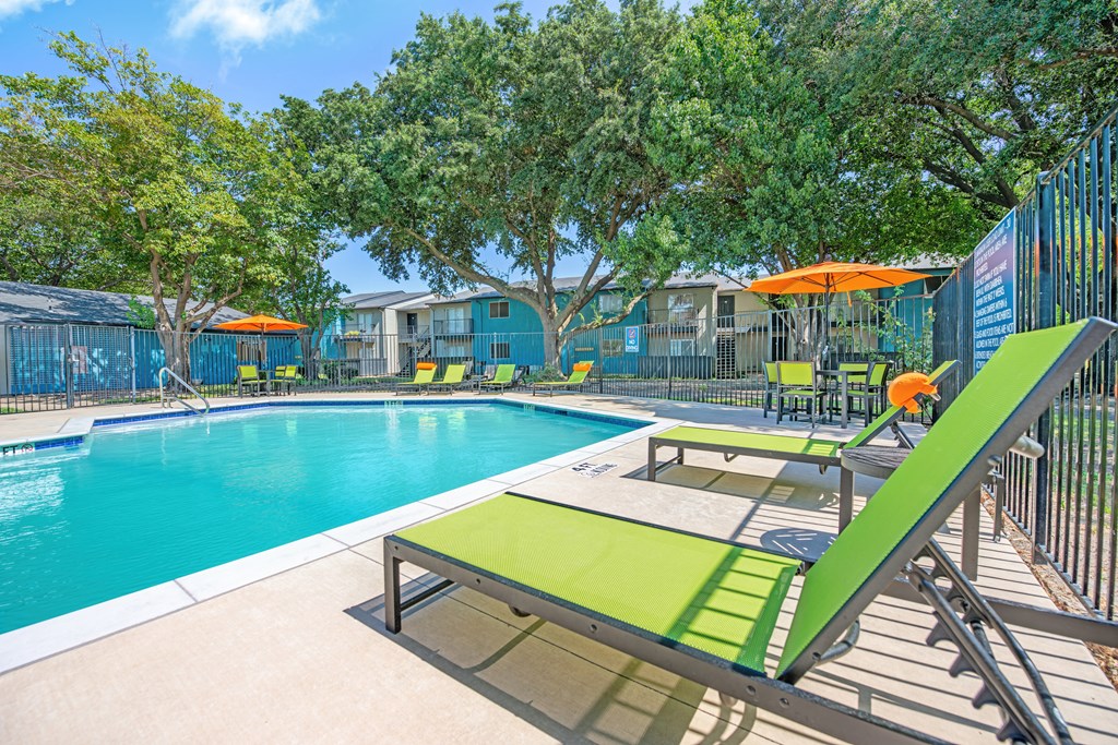 our apartments have a resort style pool and lounge chairs