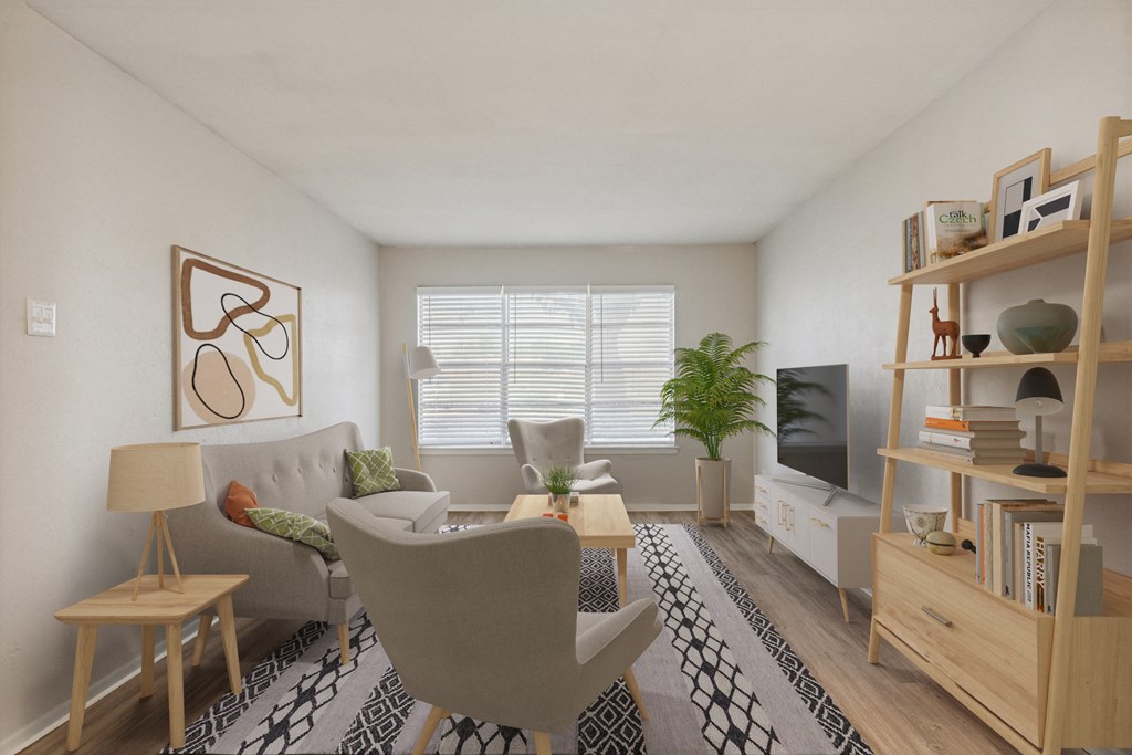a living room with white walls and hardwood floors