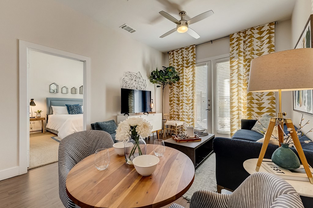 a living room and dining room with a couch and a table