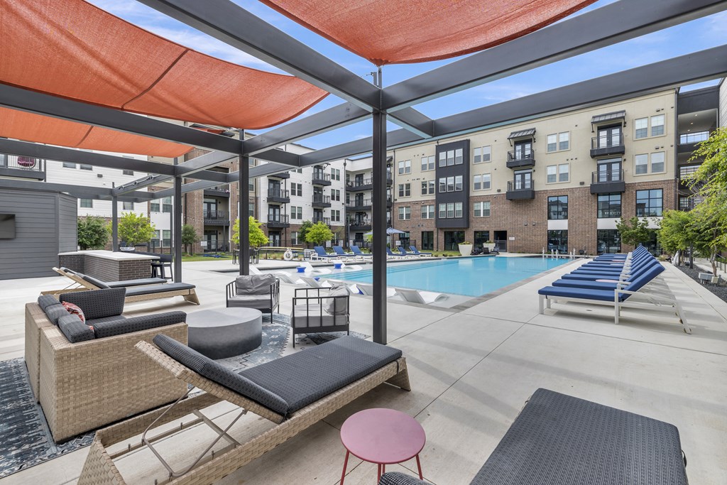 our apartments have a swimming pool with lounge chairs and umbrellas