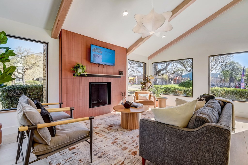 a living room with a couch and a fireplace