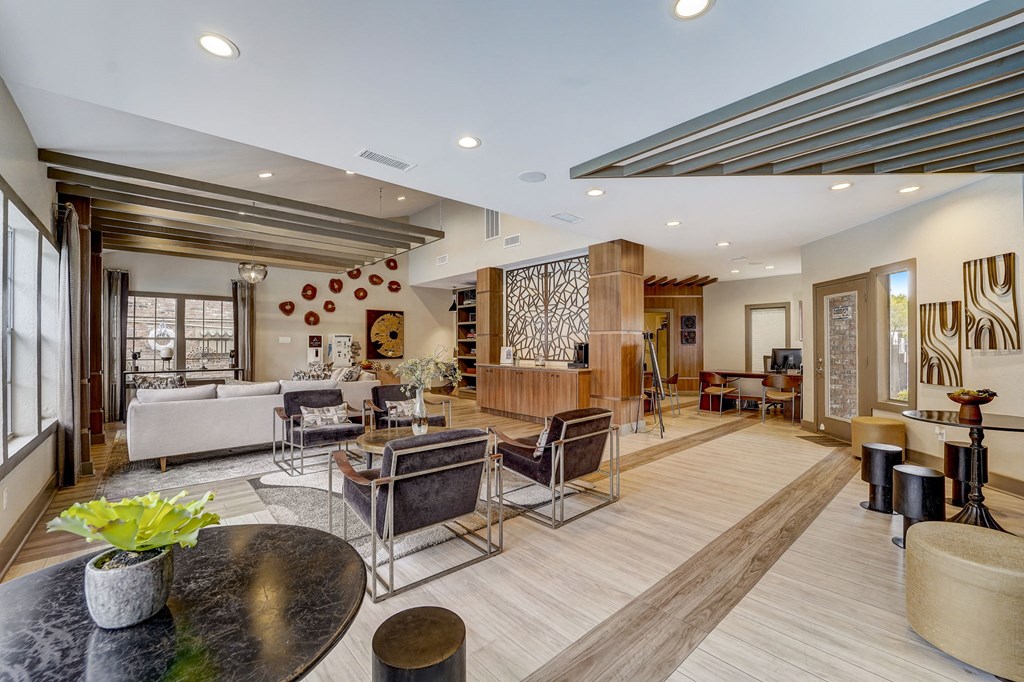 a living room with a couch and a table with chairs