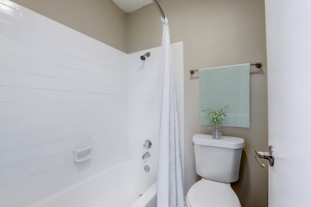 a small bathroom with a toilet and a shower