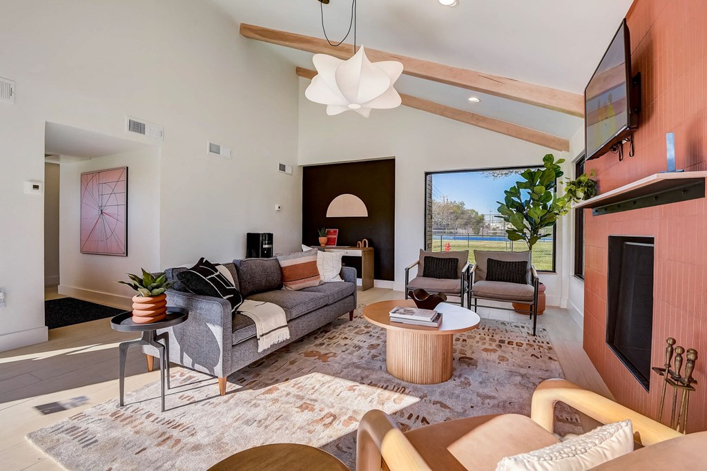 a living room with a couch and a fireplace