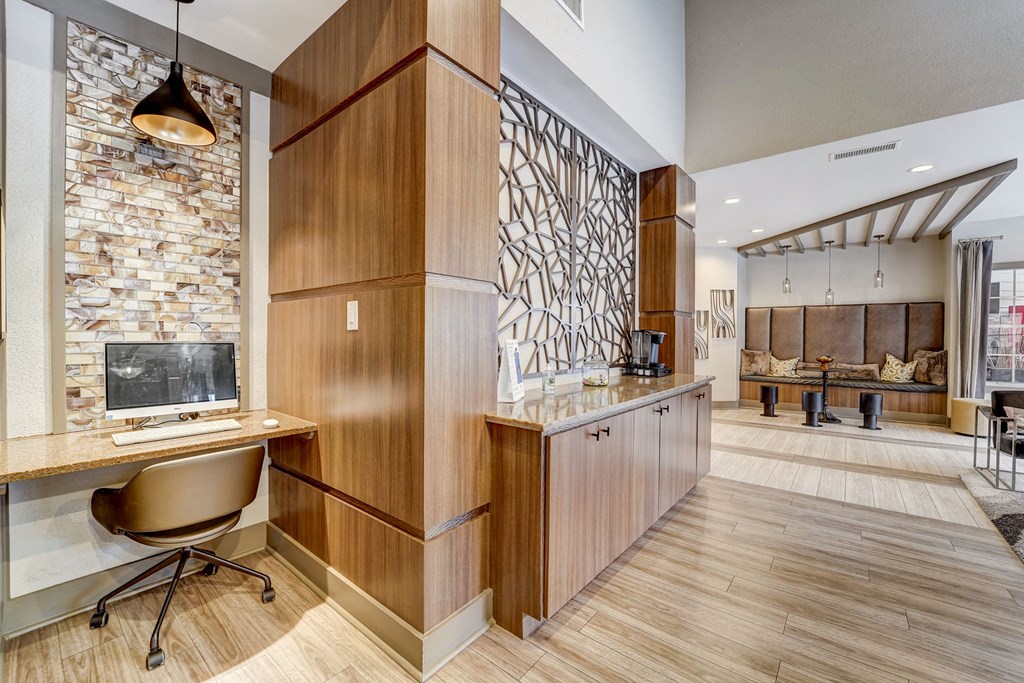 a home office with a desk and a fireplace