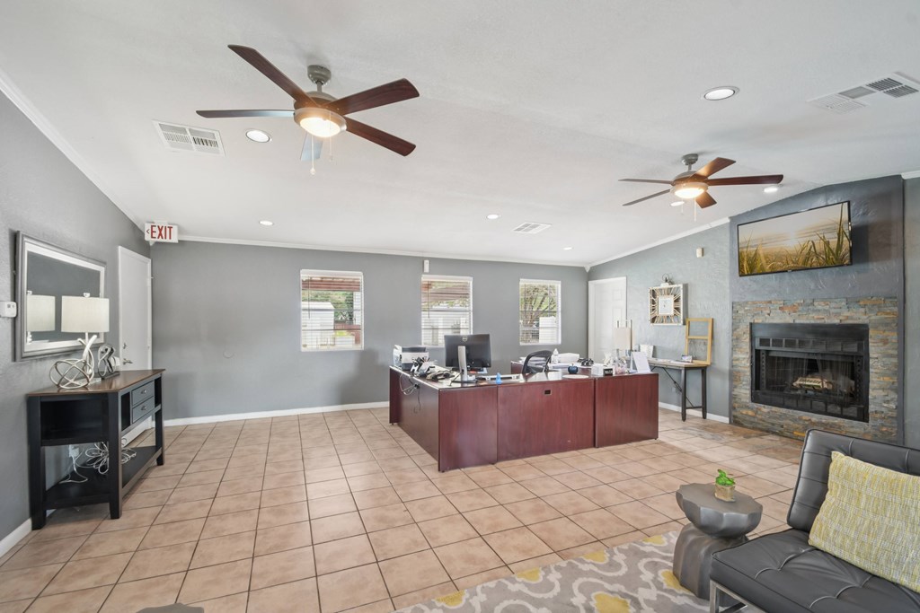 A living room with a fireplace and a couch.