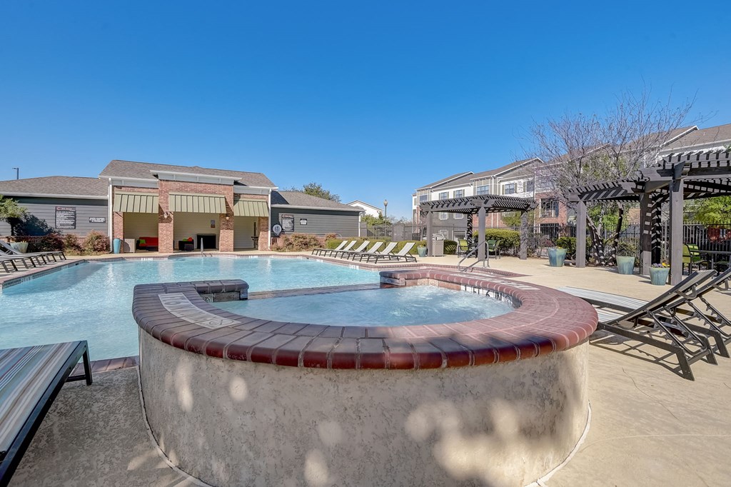 our apartments have a large swimming pool with chairs