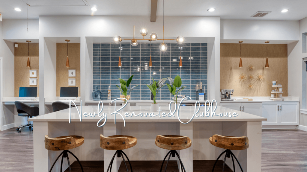 a kitchen with a white counter top and wooden stools