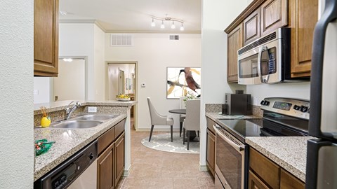 A kitchen with a black stove top oven.