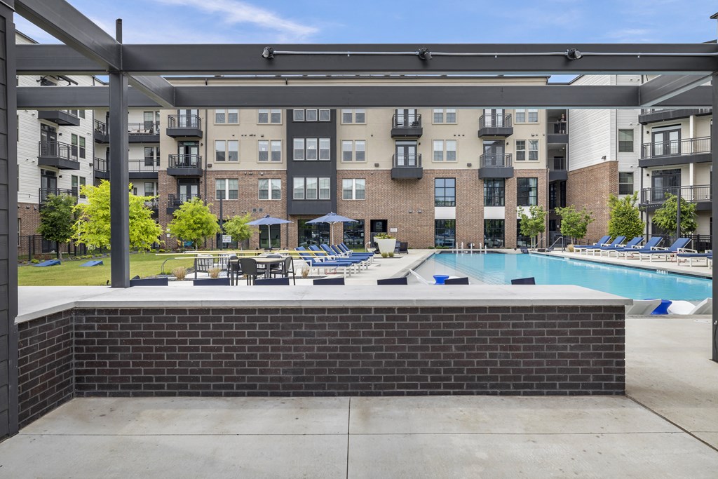 our apartments have a large pool with lounge chairs and umbrellas