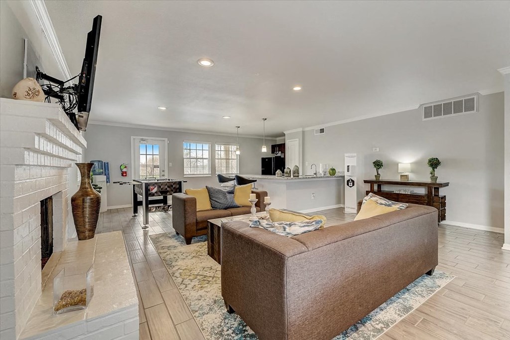 a living room with a couch and a fireplace