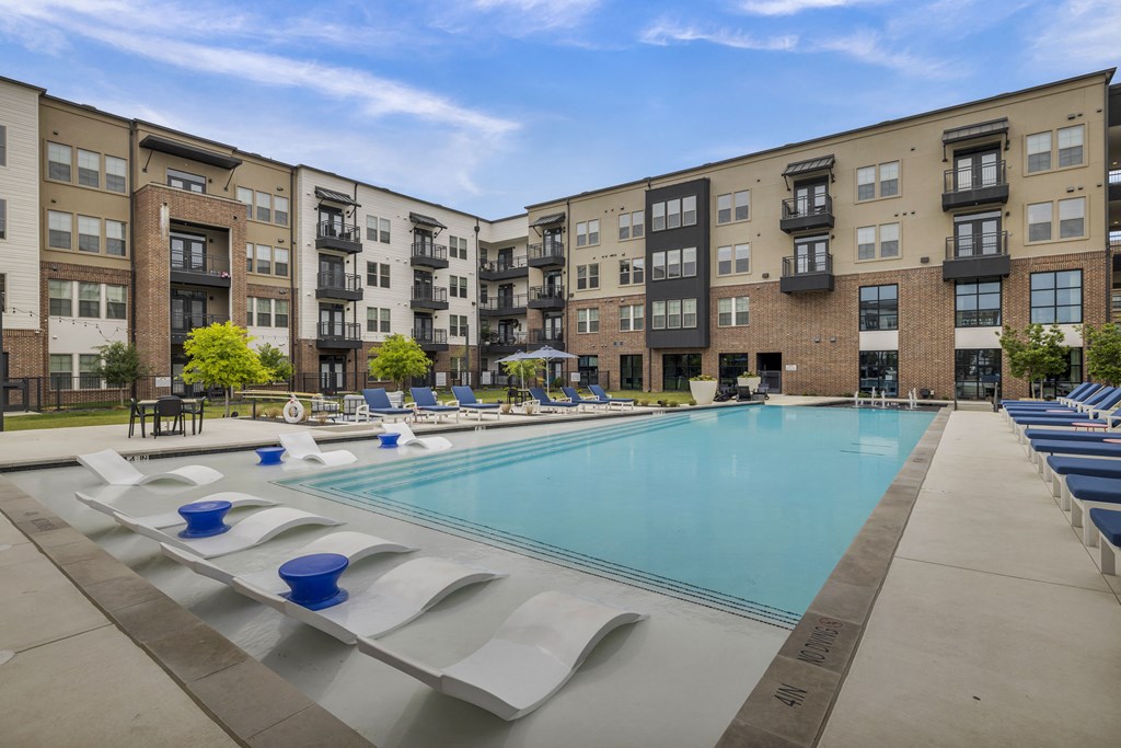our apartments have a large swimming pool with lounge chairs