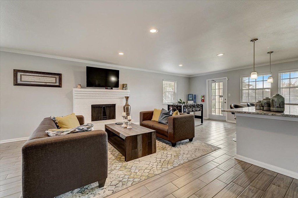 a living room with furniture and a fireplace