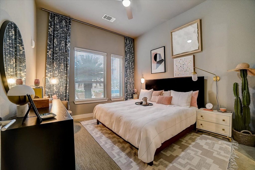 a bedroom with a bed and a desk