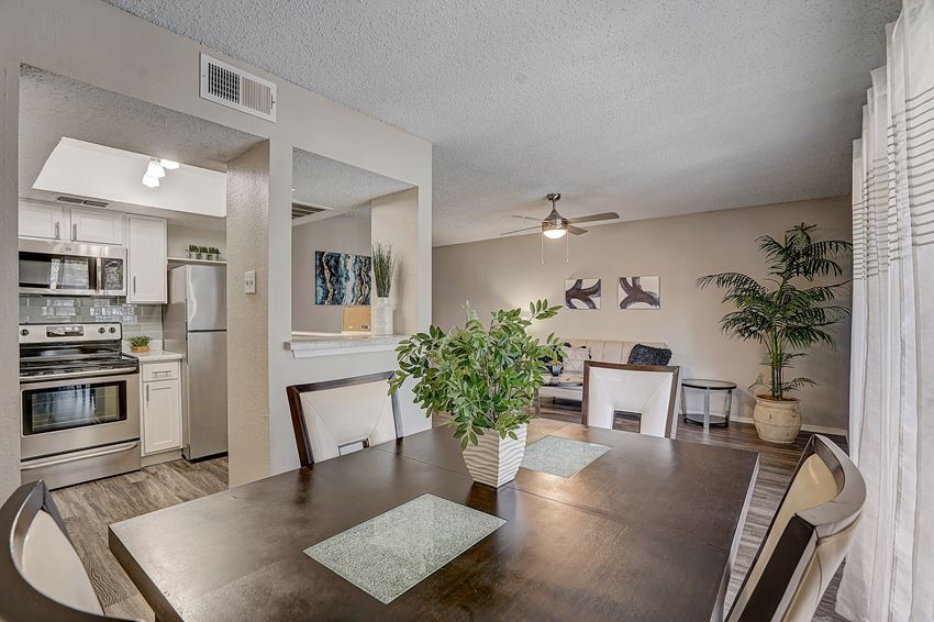 an open kitchen and dining room with a table and chairs