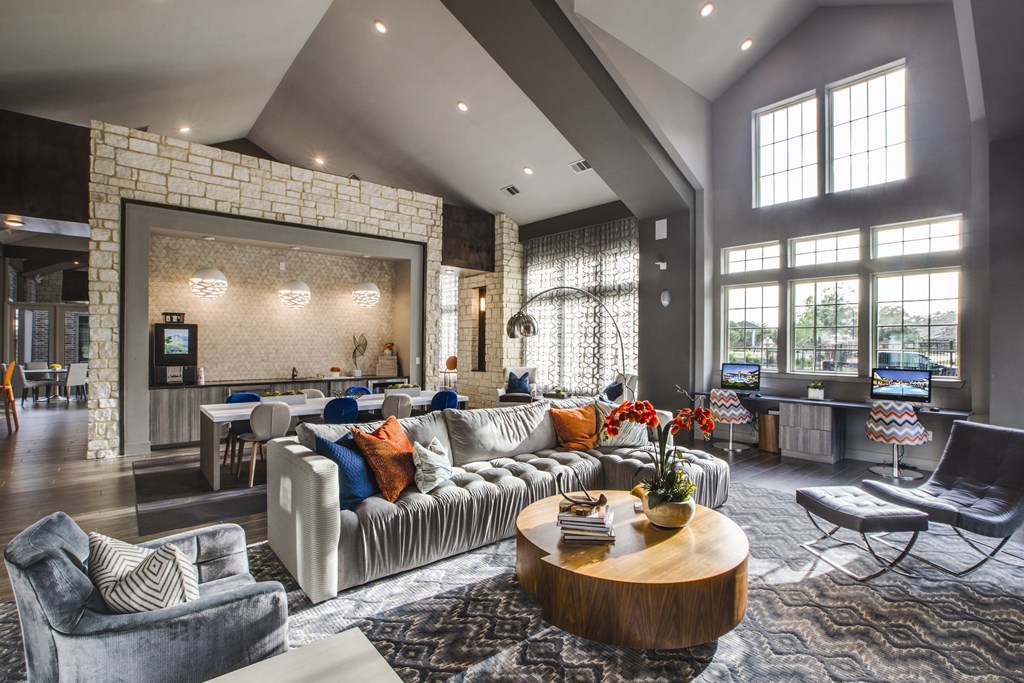 a living room filled with furniture and a large window