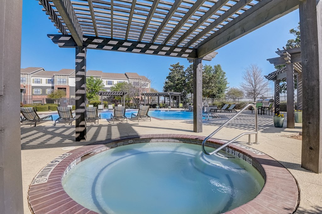 our resort style hot tub is under a shade structure at our apartments