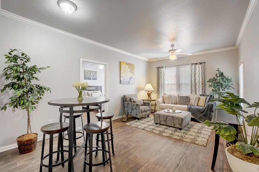 an open living room with a dining area and a living room