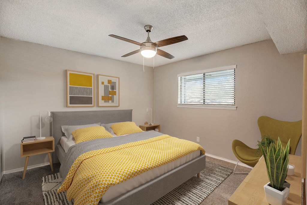 a bedroom with a bed and a ceiling fan