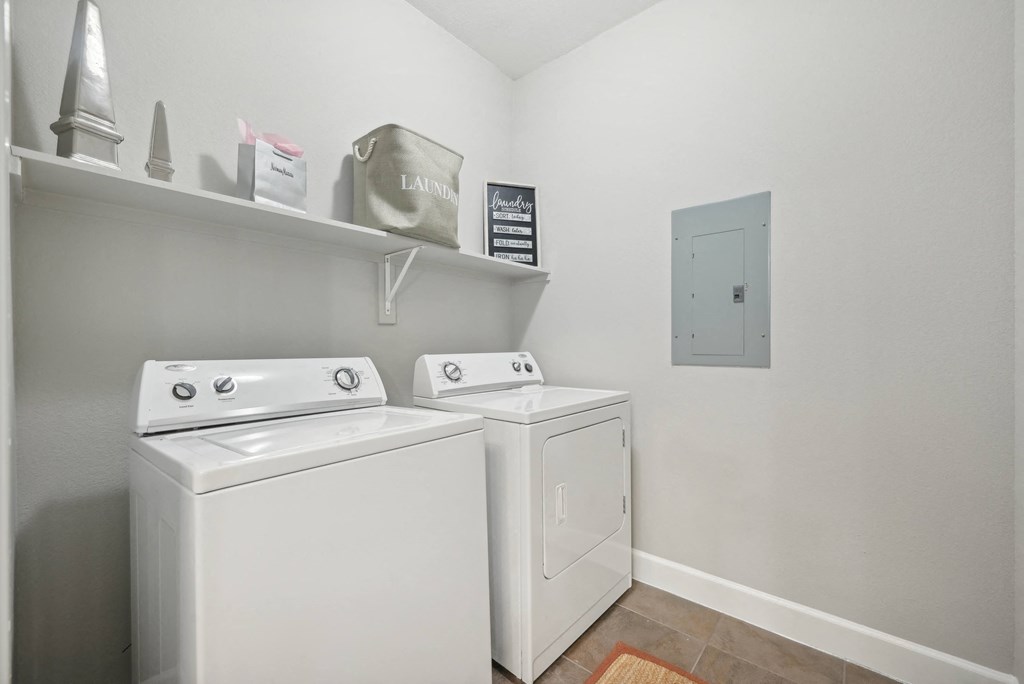 A laundry room with a washer and dryer.