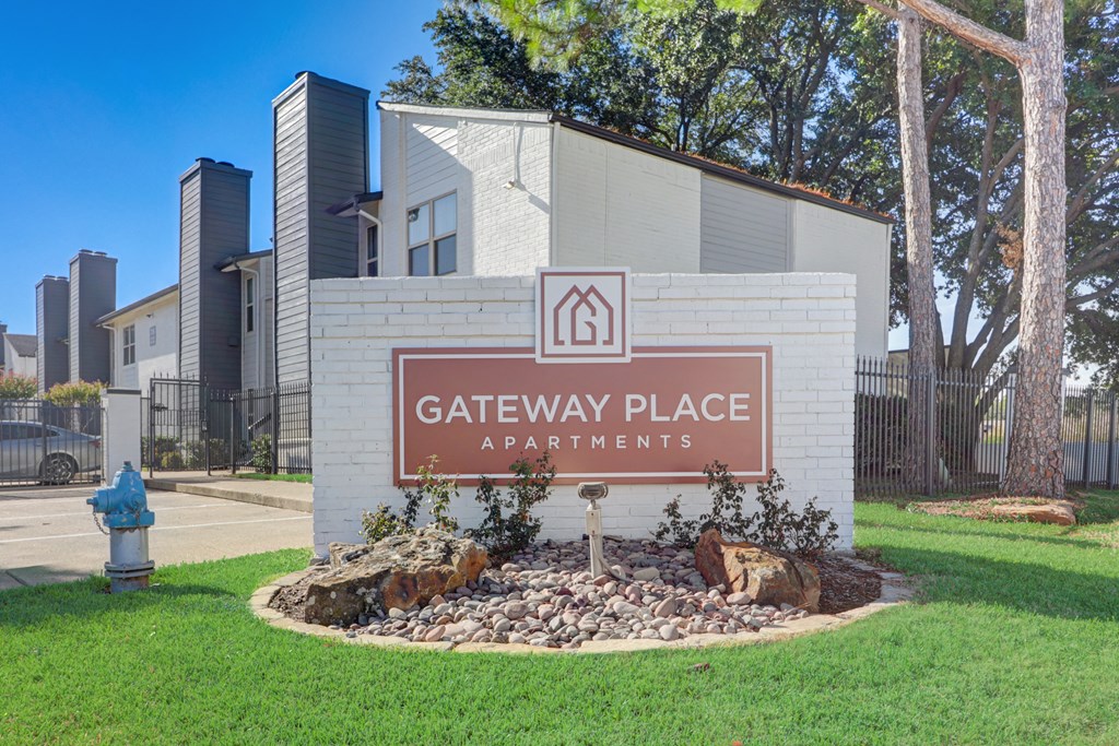 a gateway place apartments sign in front of a building