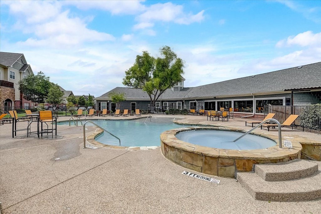 our apartments showcase an outdoor pool and hot tub