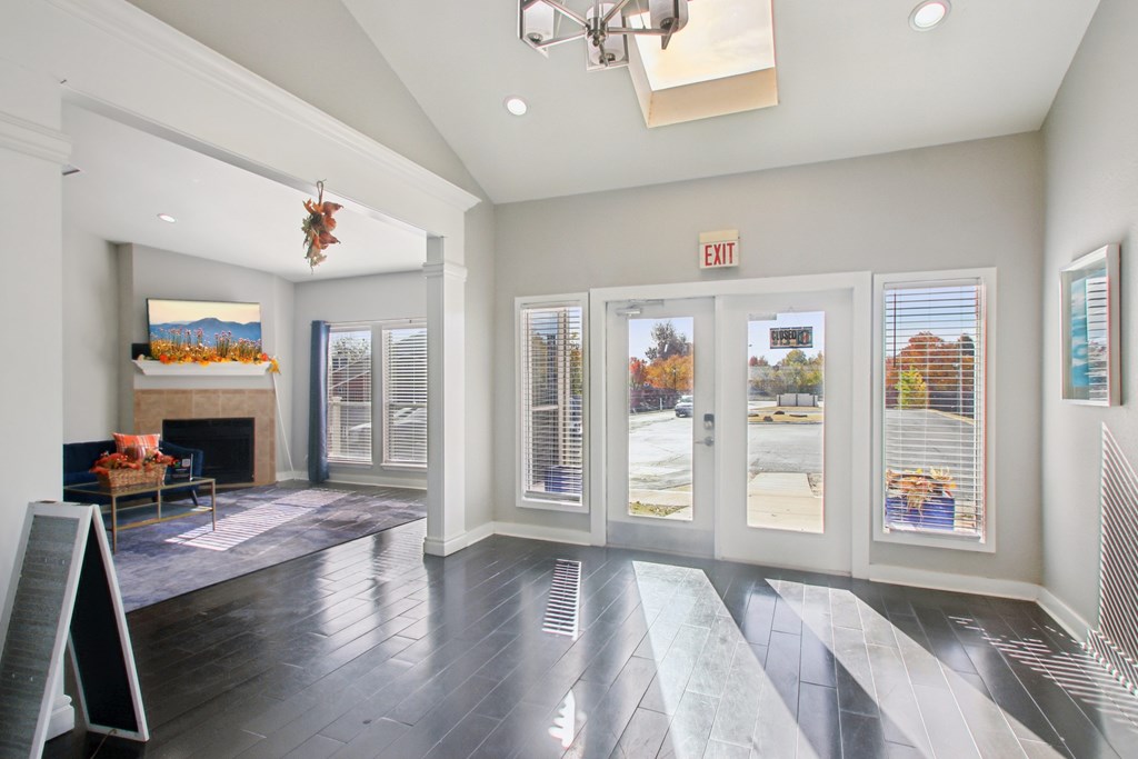 A room with a fireplace and a chandelier.