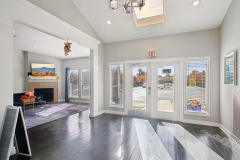 A room with a fireplace and a chandelier.